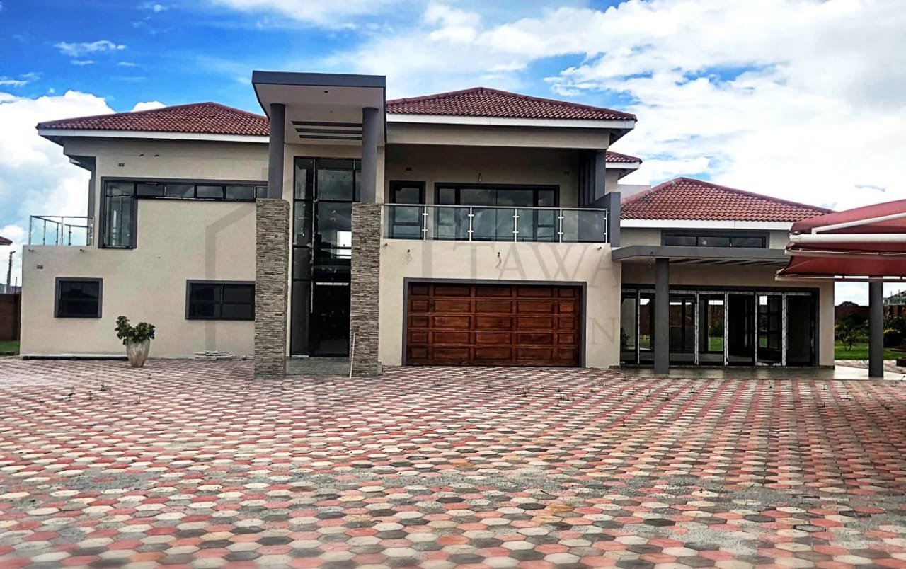 Completed modern home and paved driveway